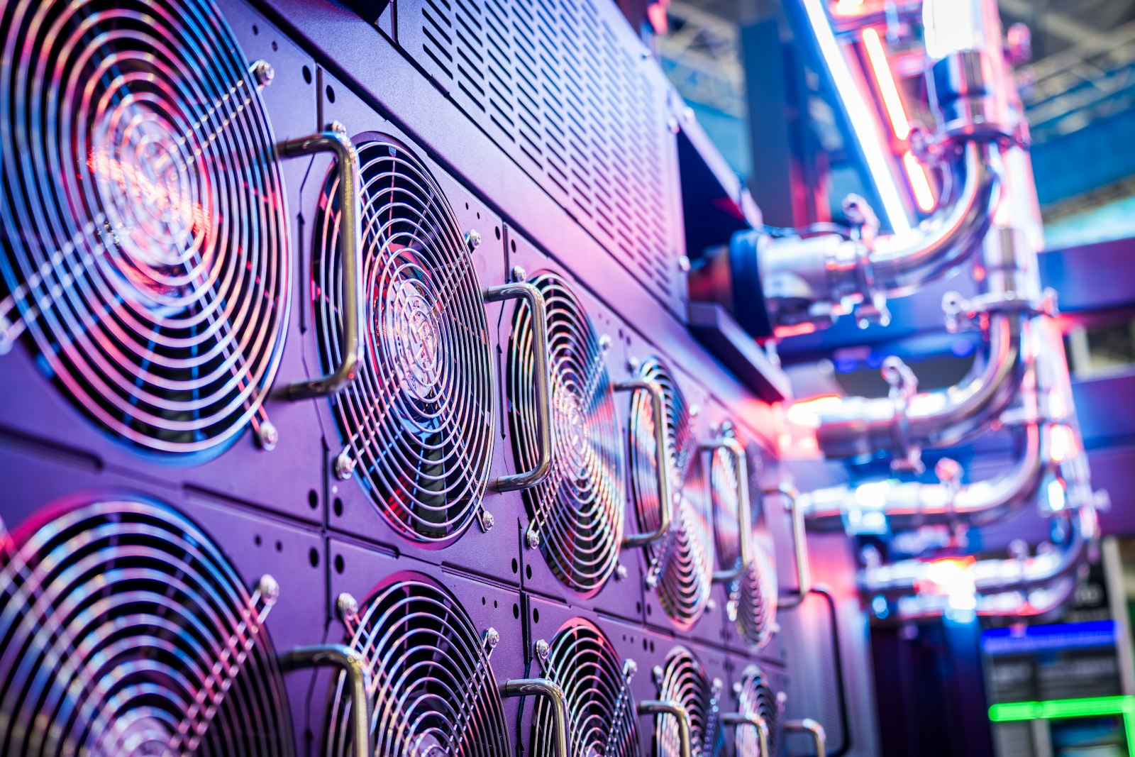 Close-up of server cooling fans in a vibrant on-premises data center, representing the private infrastructure that keeps department-specific AI agents and their data isolated inside the enterprise boundary