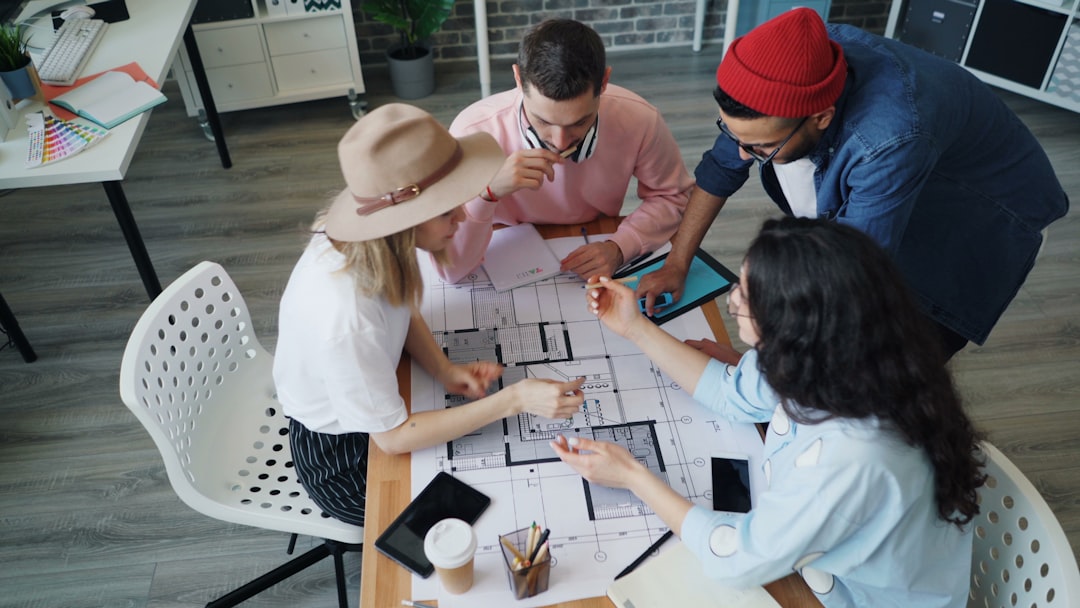 Enterprise team collaborating around a table in a business meeting