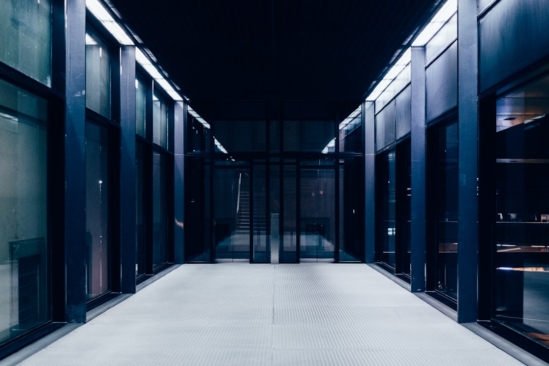 Dark infrastructure hallway representing controlled enterprise AI workflow automation